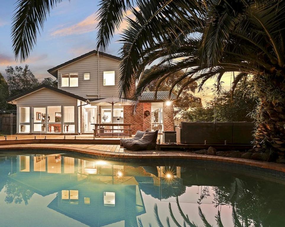a house with a swimming pool in front of a house at Coastal Family Haven with Pool - Mornington Peninsula in Frankston South