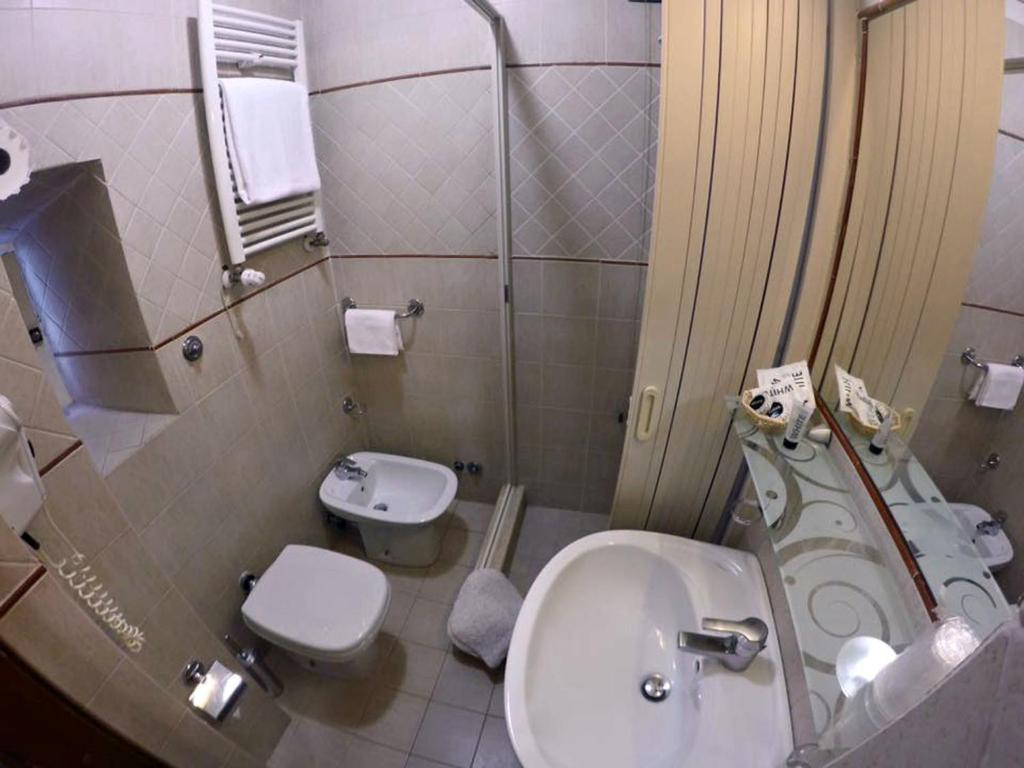 Koupelna v ubytování Hotel Assisi