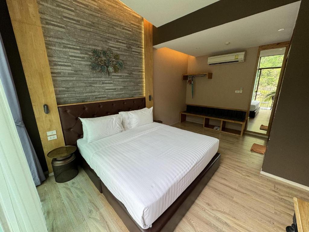 Postel nebo postele na pokoji v ubytování La Isla Pranburi Beach Resort