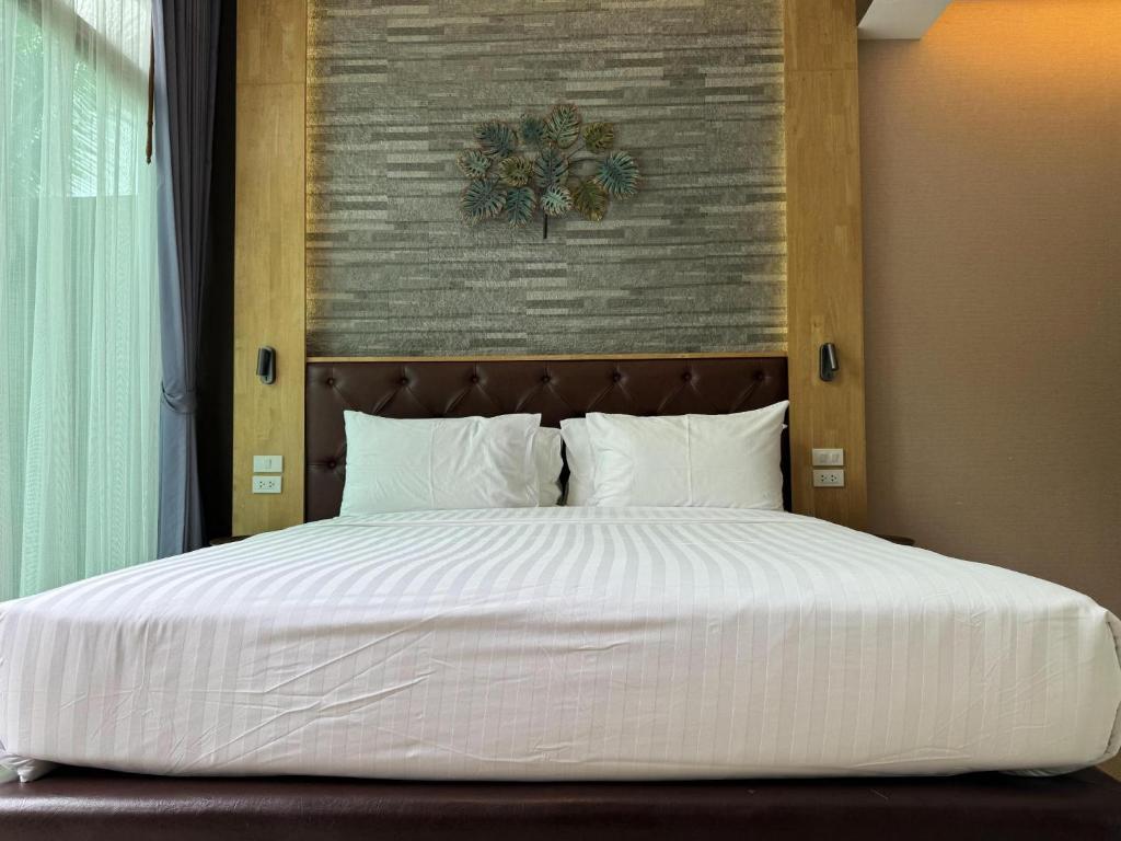 Postel nebo postele na pokoji v ubytování La Isla Pranburi Beach Resort