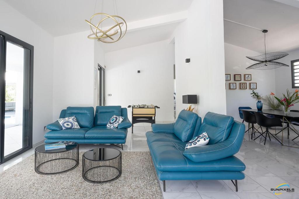Posezení v ubytování Villa Palm Diamond Jacuzzi & Piscine privés