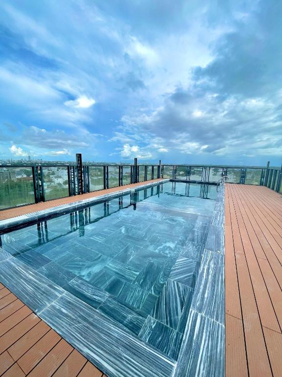 a swimming pool on the roof of a building at Linh Phuong 6 Hotel in Can Tho