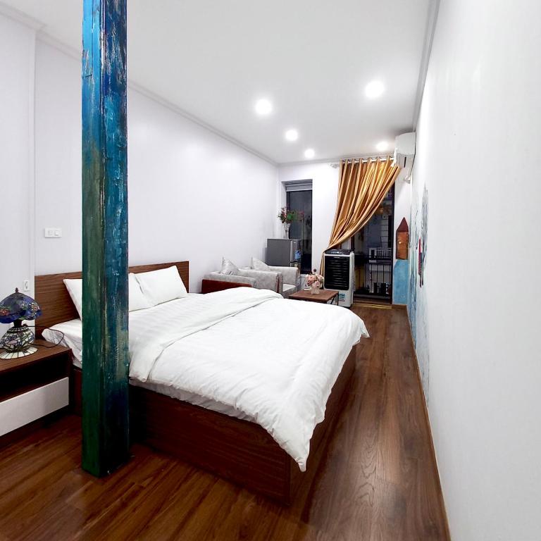 Postel nebo postele na pokoji v ubytování Amelié Homestay