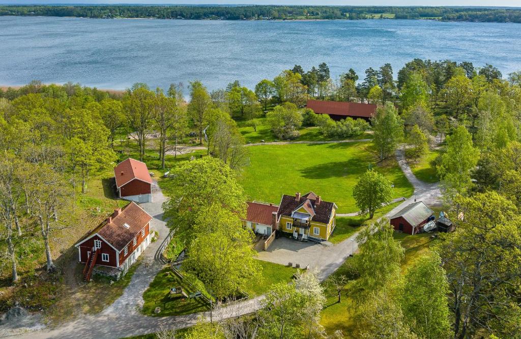 an aerial view of a house with a lake at Marsbäcken in Västervik