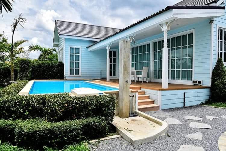 a house with a swimming pool in front of it at The Cave Valley เดอะเคฟว วัลเลย์ in Ban Chong (2)