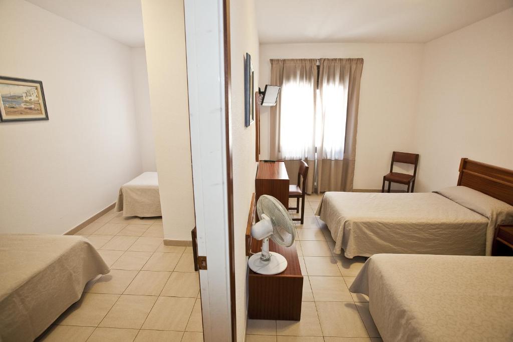 Postel nebo postele na pokoji v ubytování Hotel Beri