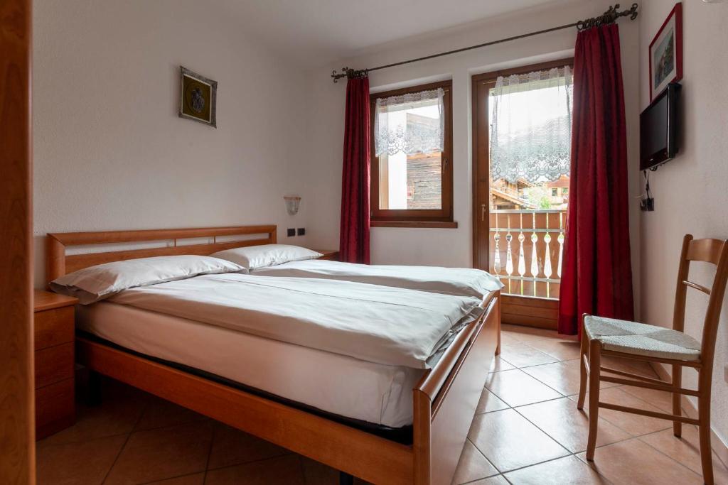 Postel nebo postele na pokoji v ubytování Appartamenti Brunnlein