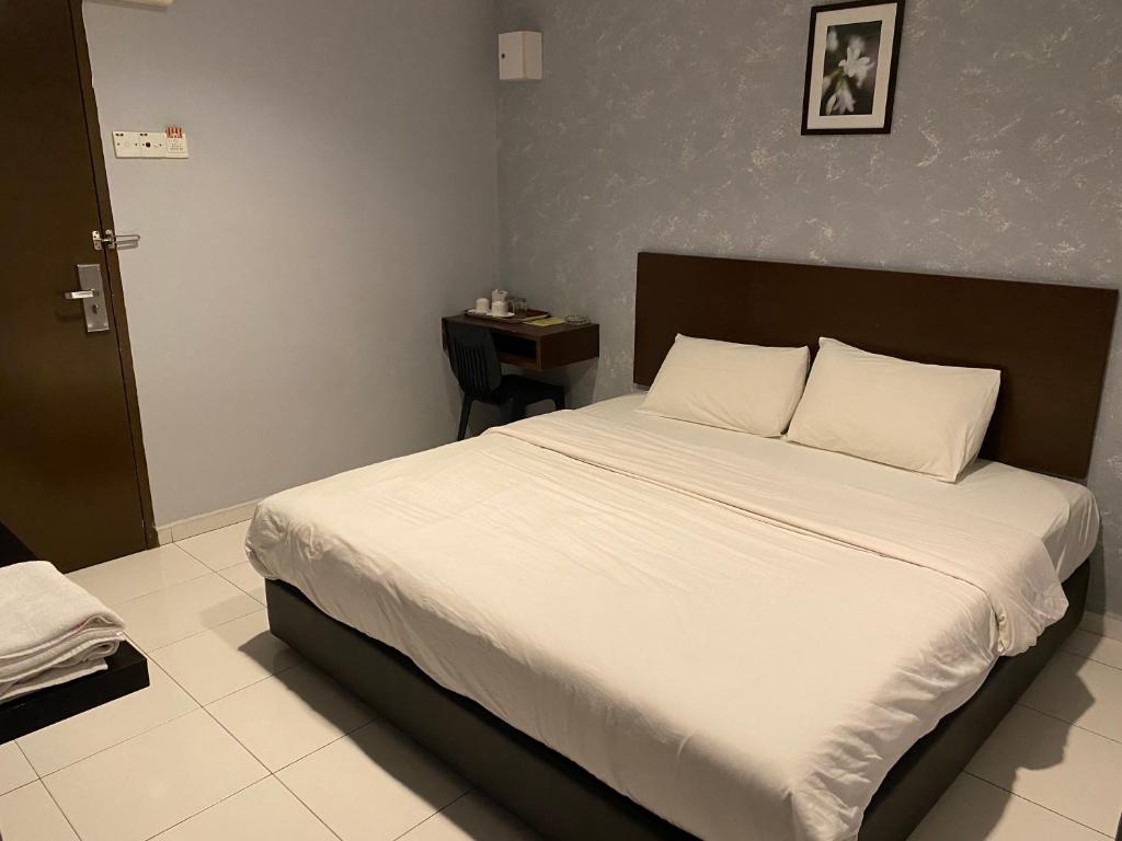 Postel nebo postele na pokoji v ubytování M Three Hotel by SECOMS
