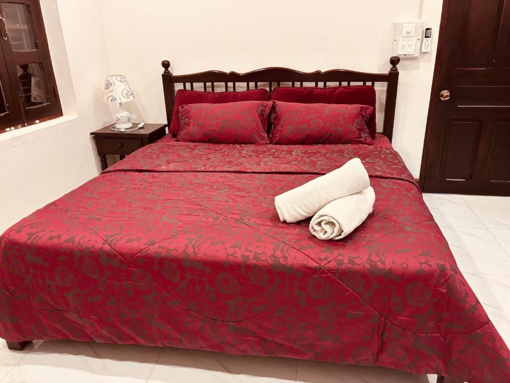 A bed or beds in a room at Mano Residence esidence