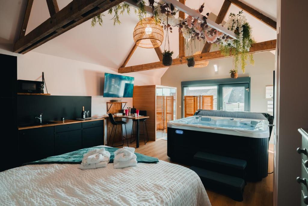 Postel nebo postele na pokoji v ubytování Au coin de Paradis