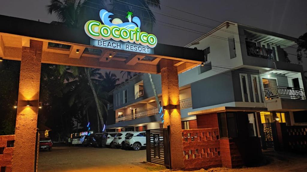 a hotel with a sign that reads coopoco beach resort at Cocorico Beach Resort in Dapoli