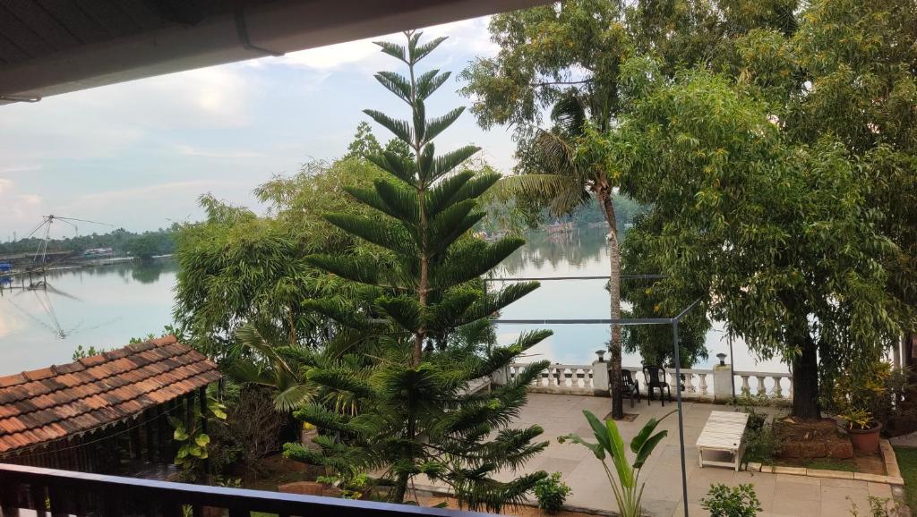 a view of a river from a balcony at Ambadi's villa -Lake view resort in Pallipuram