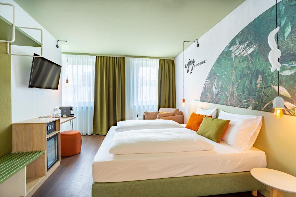Postelja oz. postelje v sobi nastanitve The Weekend Hotel