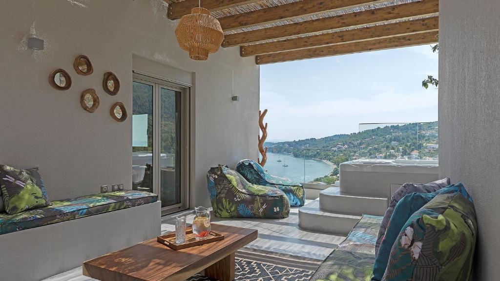 a living room with a view of the water at Super Luxury Skiathos Villa Five-Bedroom Villa Private Infinity Pool & Astounding Sea Views Skiathos Town in Skiathos Town
