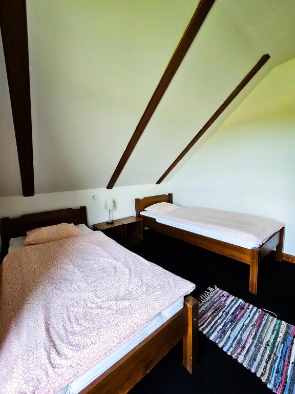 Posteľ alebo postele v izbe v ubytovaní Gościniec Gryszczeniówka & SPA