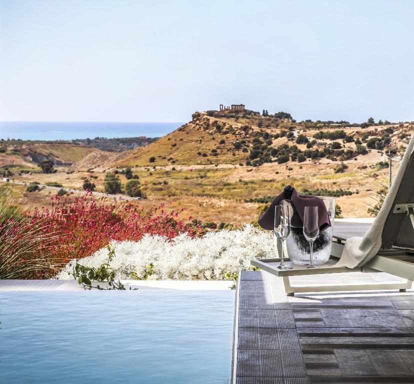 a house with a view of a pool at Doric Eco Boutique Resort & Spa - Sicily in Agrigento