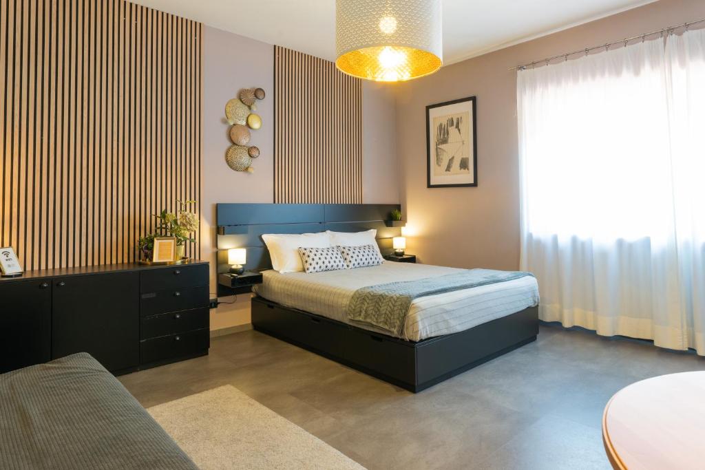 Llit o llits en una habitació de Villaggio Tranquillo - bambnb