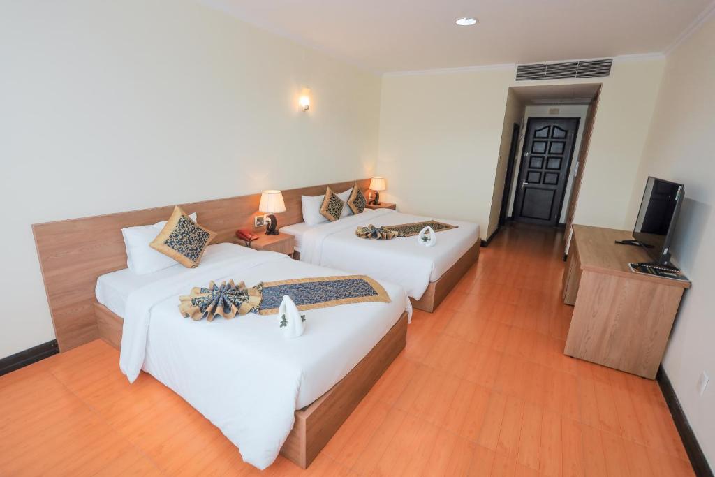 Postel nebo postele na pokoji v ubytování T.26 Hotel