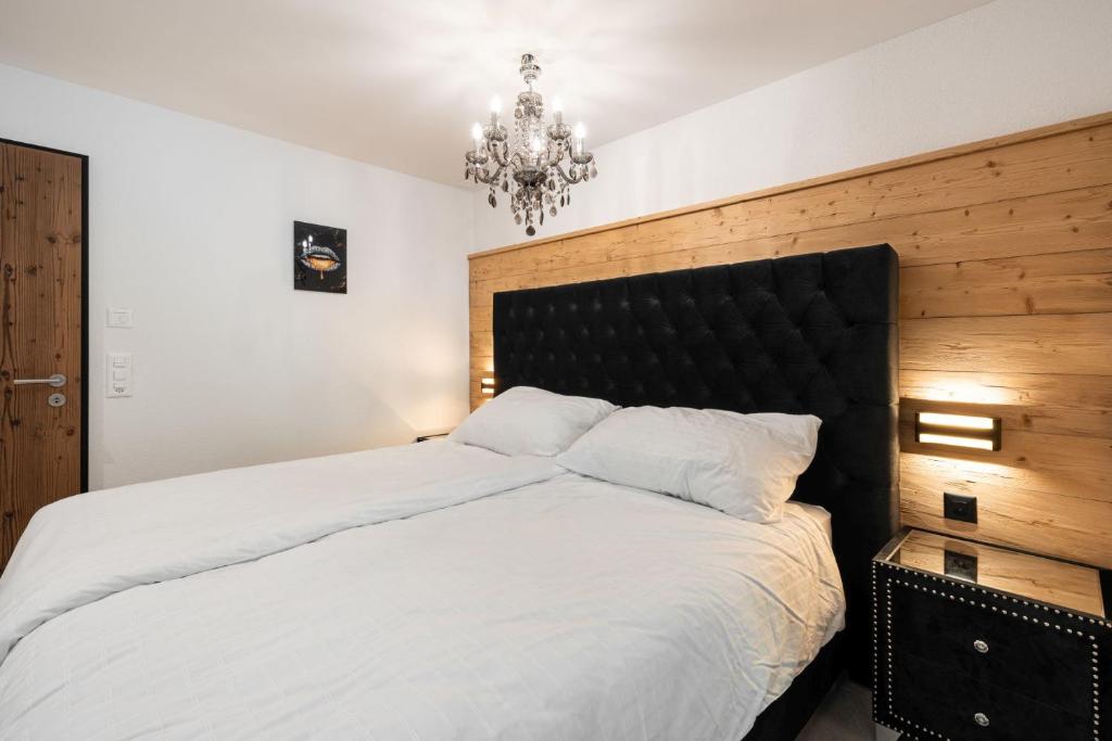 Postel nebo postele na pokoji v ubytování Melchtal Resort Apart Hotel