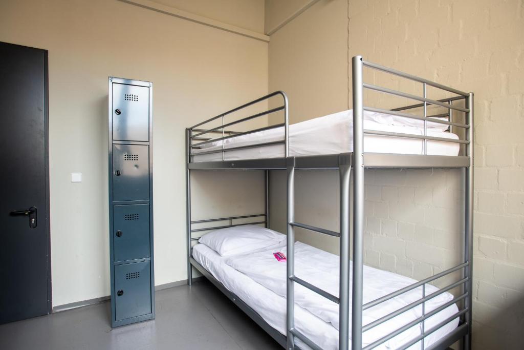 Postel nebo postele na pokoji v ubytování WALLYARD Stay