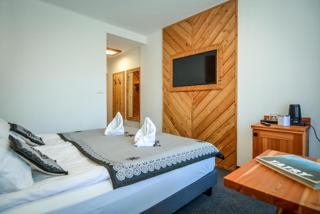 Posteľ alebo postele v izbe v ubytovaní My Tatra Residence