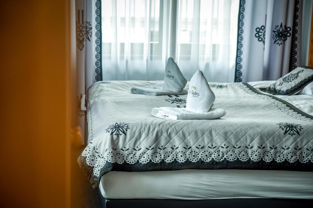 Posteľ alebo postele v izbe v ubytovaní My Tatra Residence
