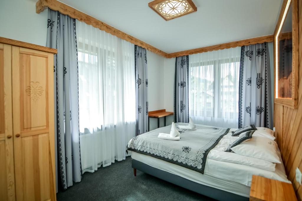 Posteľ alebo postele v izbe v ubytovaní My Tatra Residence