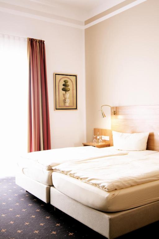 Postel nebo postele na pokoji v ubytování Hotel Tiek Superior