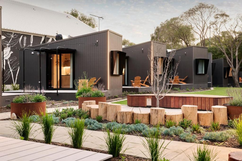 a house with a garden in front of it at Southcamp in Dunsborough