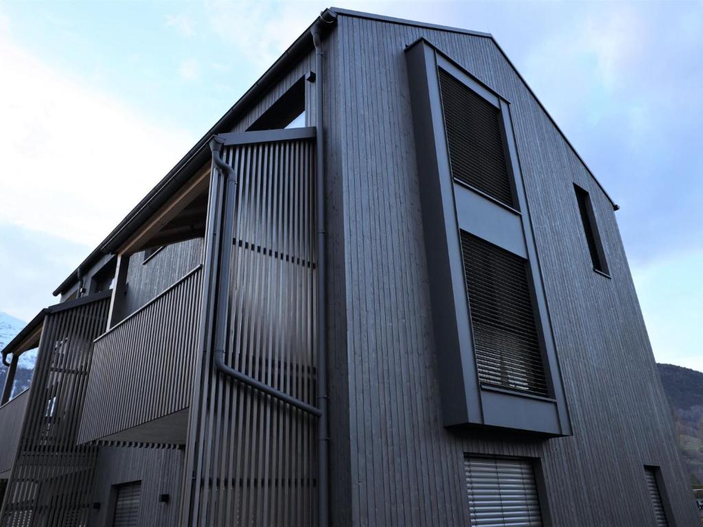 a building with many windows on the side of it at Beautiful apartment in Mieders in a sunny location in Mieders