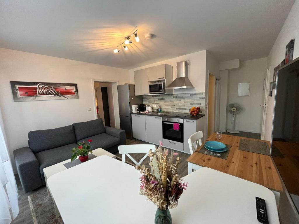 a living room with a couch and a table at Schubart Apartments in Bietigheim-Bissingen