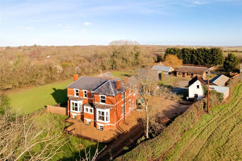 an aerial view of a house on a hill at Equestrian Idyllic Victorian Retreat 
