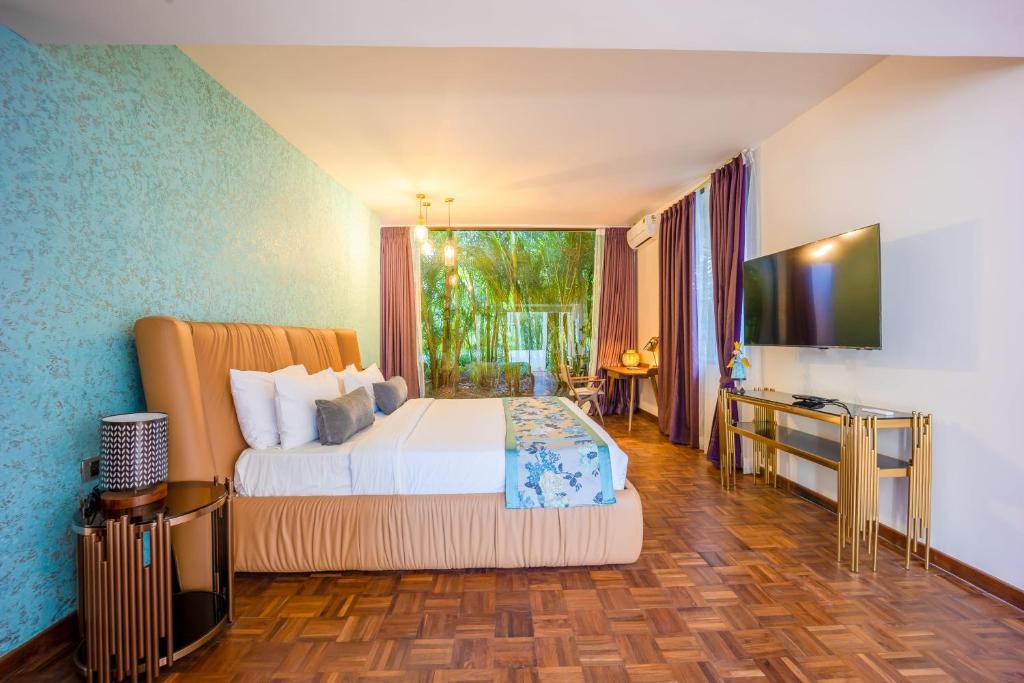 Voodi või voodid majutusasutuse Java Rain Resort toas