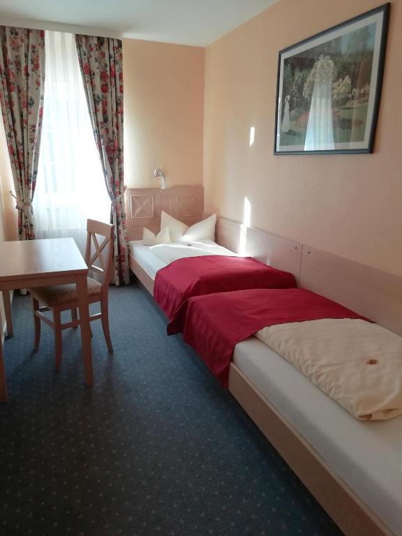 Postel nebo postele na pokoji v ubytování Hotel Acht Linden