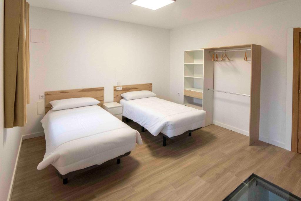 Postel nebo postele na pokoji v ubytování Apartamento Casa Borderías