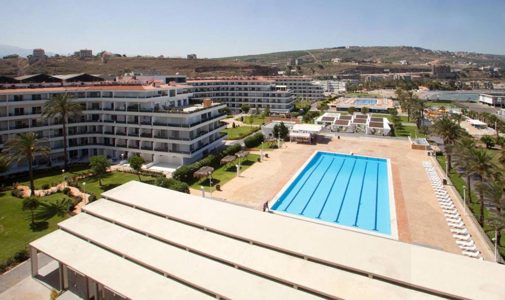 an aerial view of a hotel with a swimming pool at Stunning Sea Front Chalet In Tripoli in Trâblous