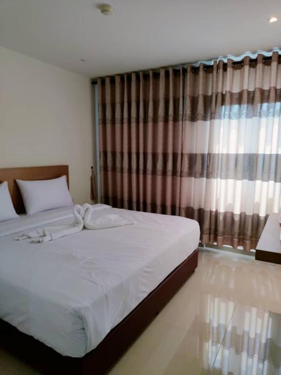 Postel nebo postele na pokoji v ubytování One Dream Hotel