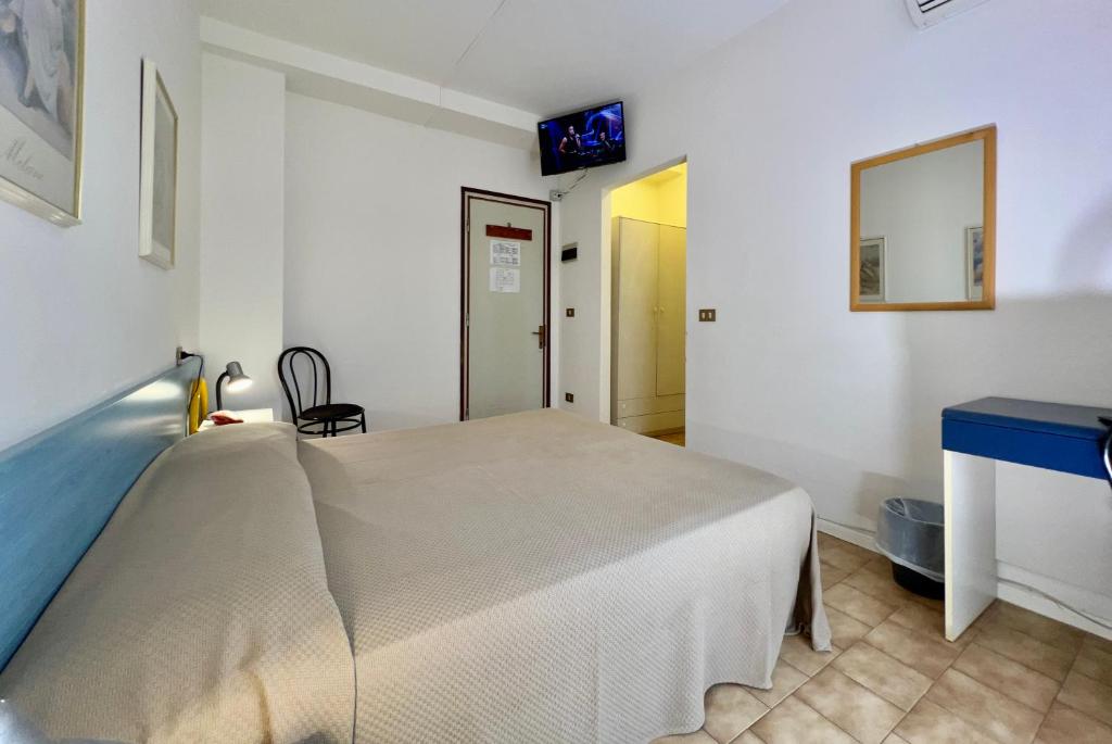 Postel nebo postele na pokoji v ubytování Hotel Myriam