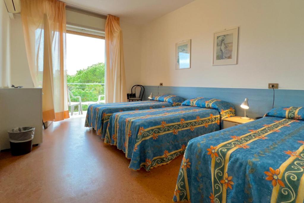 Postel nebo postele na pokoji v ubytování Hotel Myriam