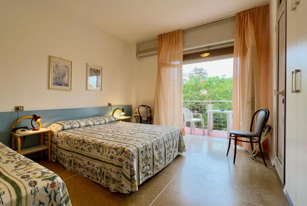 Postel nebo postele na pokoji v ubytování Hotel Myriam
