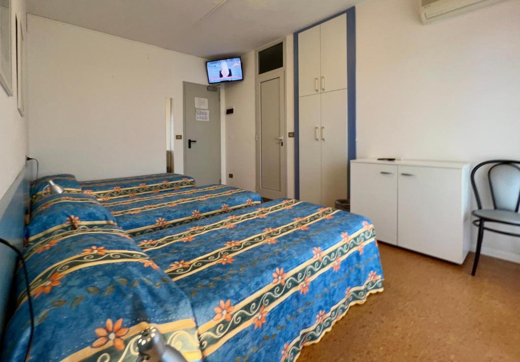 Postel nebo postele na pokoji v ubytování Hotel Myriam