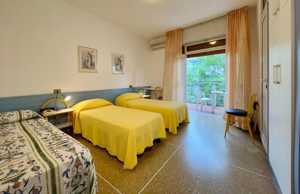 Postel nebo postele na pokoji v ubytování Hotel Myriam