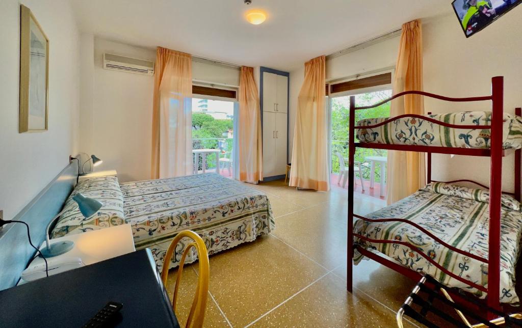 Postel nebo postele na pokoji v ubytování Hotel Myriam