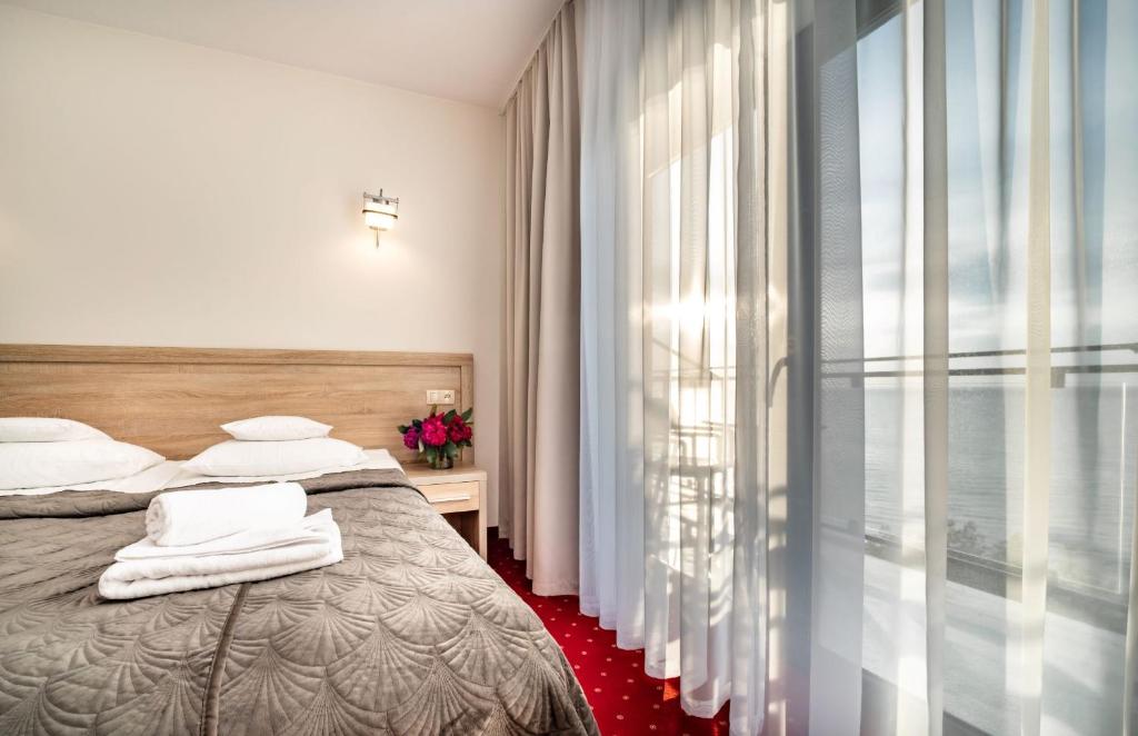 Postel nebo postele na pokoji v ubytování Sunset Spa