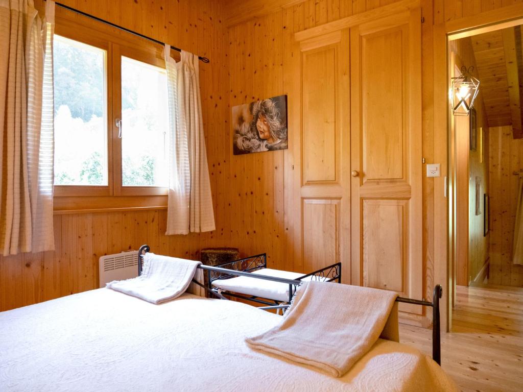 Postel nebo postele na pokoji v ubytování Chalet Miranda by Interhome