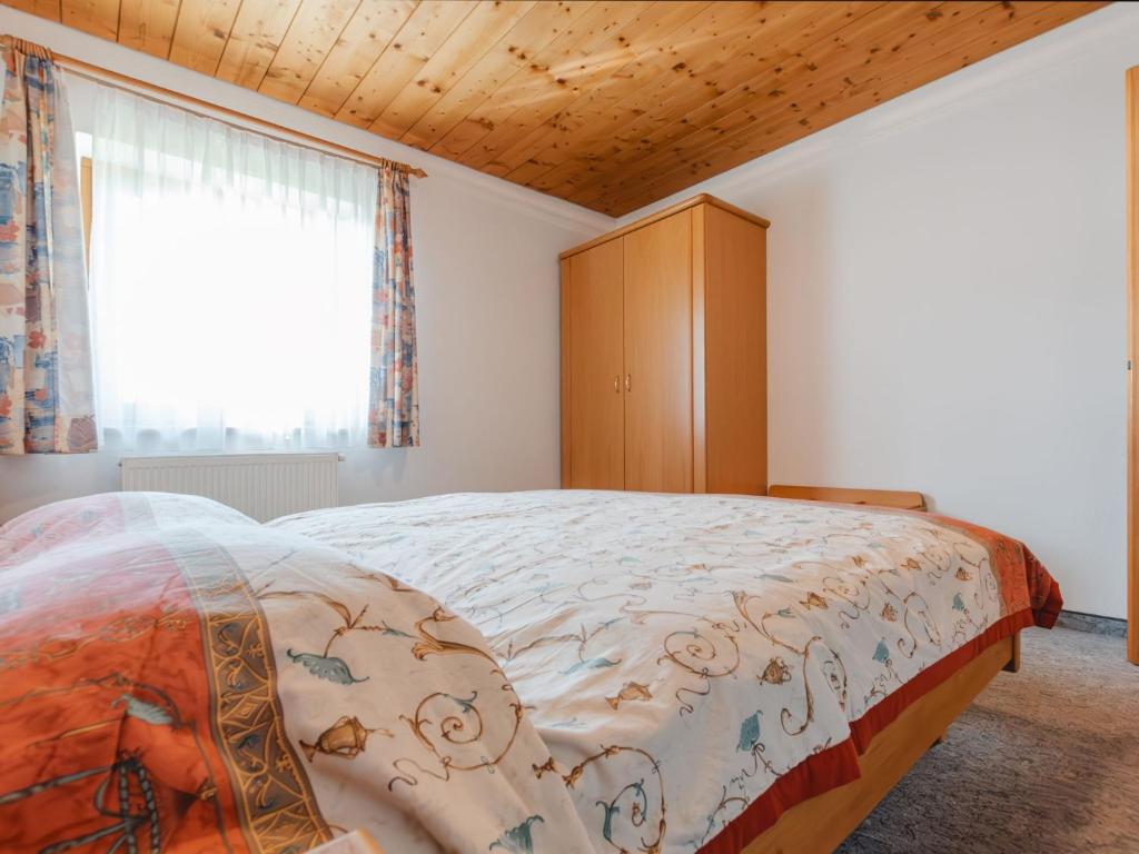 A bed or beds in a room at Apartment Voithofer-7 by Interhome
