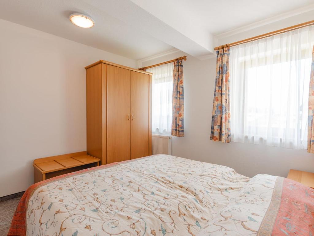 A bed or beds in a room at Apartment Voithofer-7 by Interhome