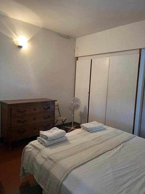 Ein Bett oder Betten in einem Zimmer der Unterkunft Terrazza tra gli ulivi