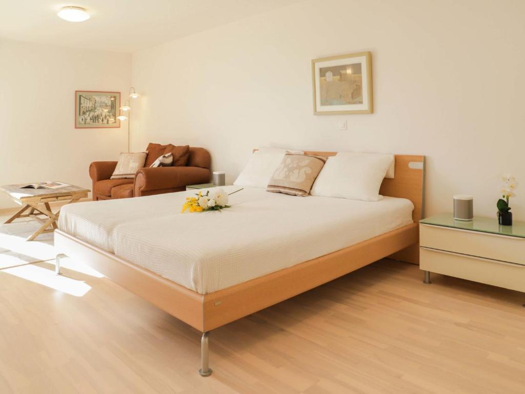 Postelja oz. postelje v sobi nastanitve Apartment Les Cîmes 8 by Interhome