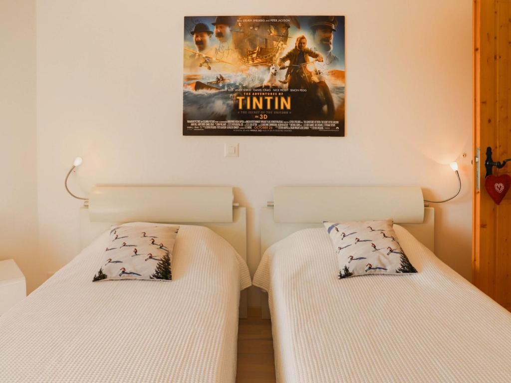 Postelja oz. postelje v sobi nastanitve Apartment Les Cîmes 8 by Interhome
